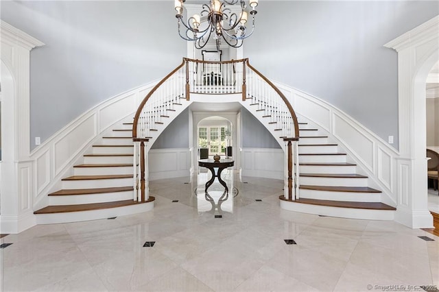 foyer featuring a chandelier and a high ceiling