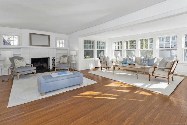 sunroom with a brick fireplace