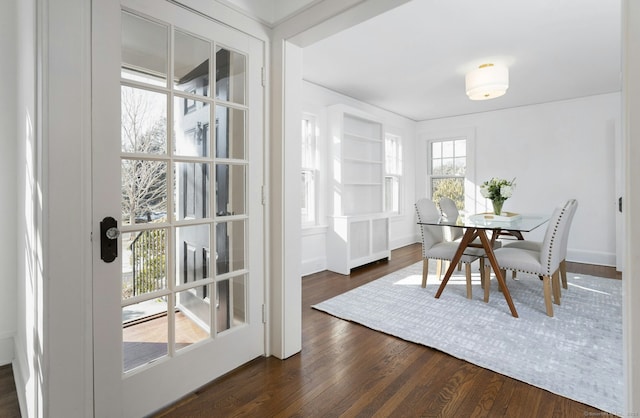 dining room featuring dark wood-style flooring