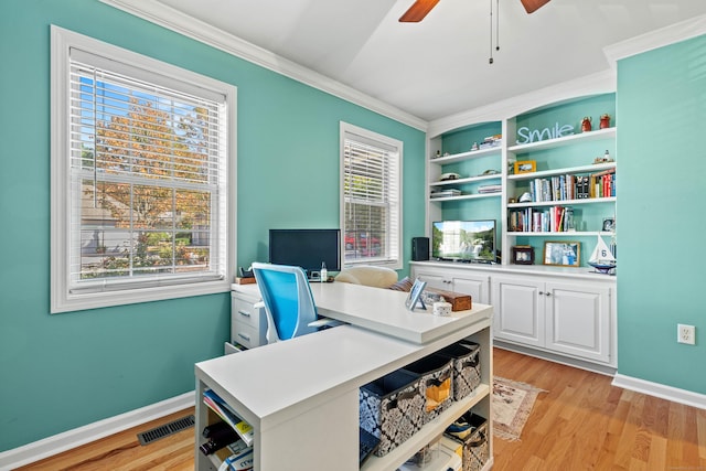 office area featuring light wood-type flooring, crown molding, and ceiling fan