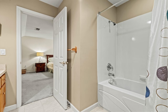 bathroom with shower / tub combo with curtain, vanity, lofted ceiling, and tile patterned floors