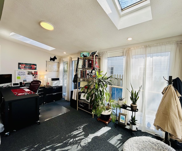 office featuring a textured ceiling and a skylight