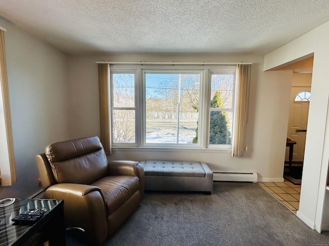 living area with a baseboard radiator, tile patterned flooring, carpet flooring, and a textured ceiling