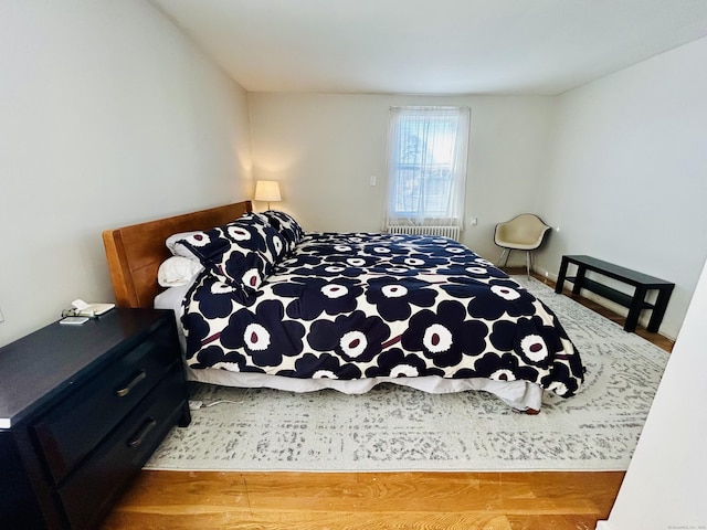 bedroom featuring radiator heating unit