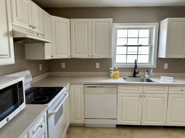 kitchen with electric range, white dishwasher, white cabinets, and sink