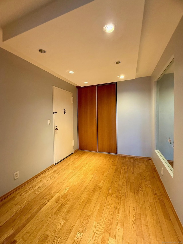 spare room featuring light hardwood / wood-style flooring