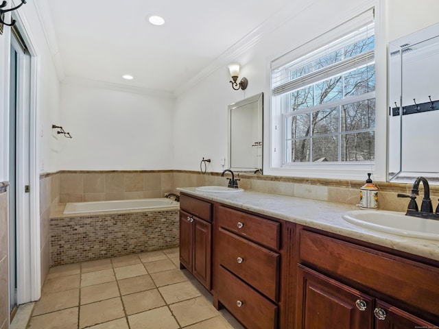 bathroom featuring crown molding, a sink, and double vanity