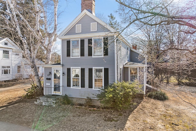 view of front of home with a chimney