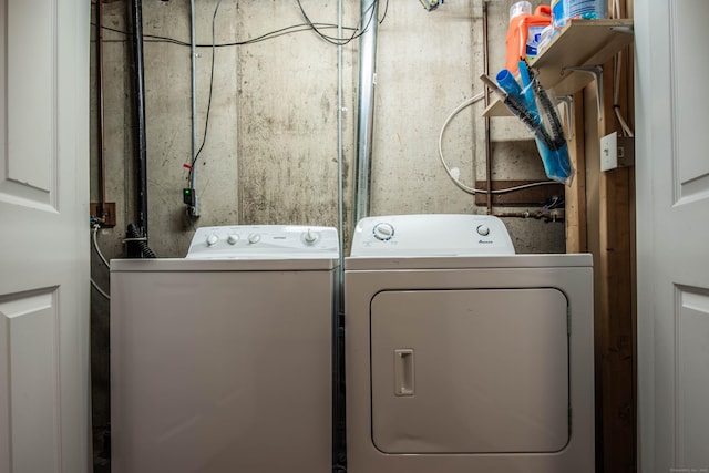 clothes washing area with laundry area and separate washer and dryer