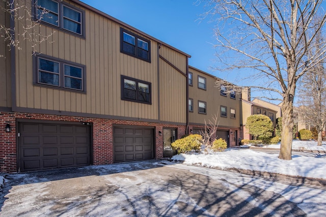 exterior space featuring driveway and an attached garage