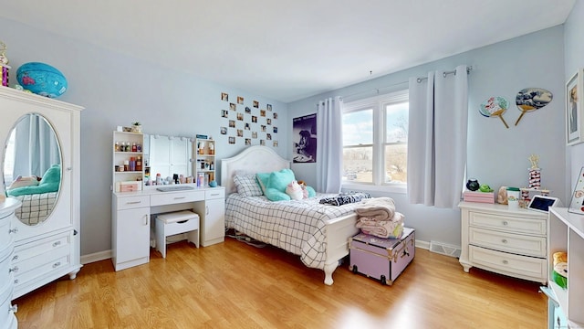 bedroom featuring light wood-type flooring