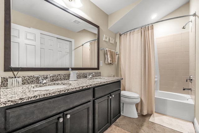 full bathroom with toilet, tile patterned floors, shower / tub combo with curtain, and vanity