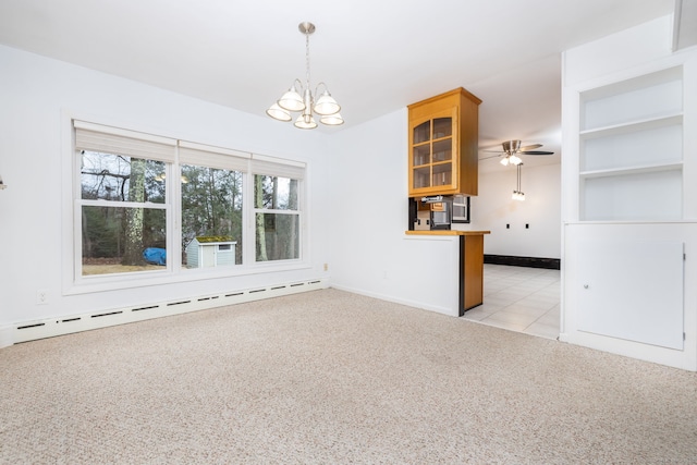 spare room with light carpet, baseboards, a baseboard heating unit, and ceiling fan with notable chandelier