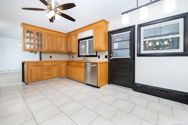 kitchen with light countertops, stainless steel dishwasher, a baseboard heating unit, glass insert cabinets, and a sink