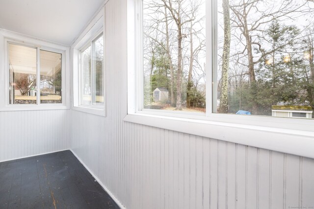 unfurnished sunroom with a healthy amount of sunlight