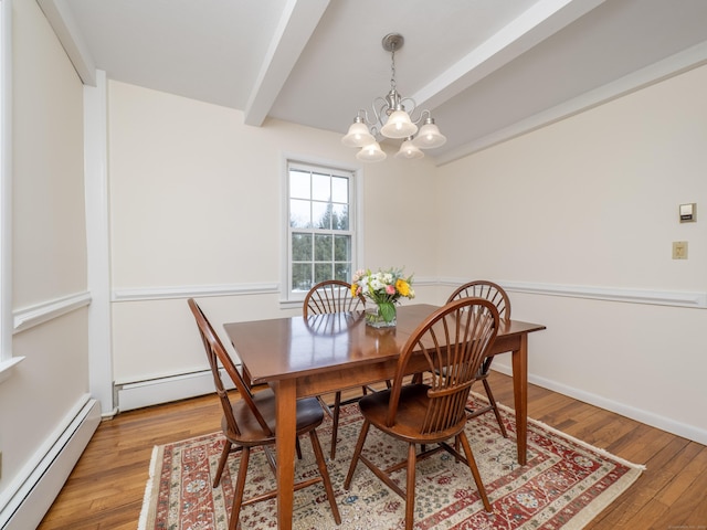 dining room featuring light wood-style floors, a baseboard heating unit, a chandelier, and beamed ceiling