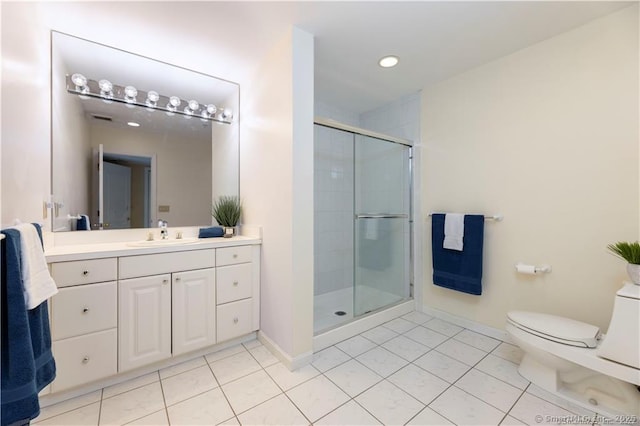 bathroom featuring toilet, a stall shower, tile patterned flooring, baseboards, and vanity