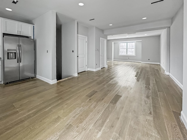 unfurnished living room featuring light hardwood / wood-style flooring