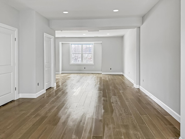 spare room with dark hardwood / wood-style flooring