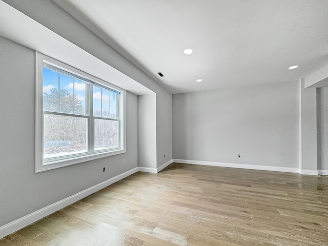 unfurnished room featuring light hardwood / wood-style flooring