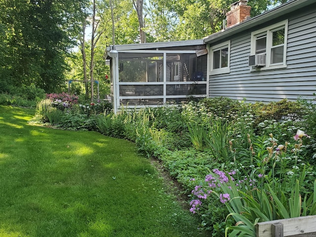 view of yard featuring a sunroom