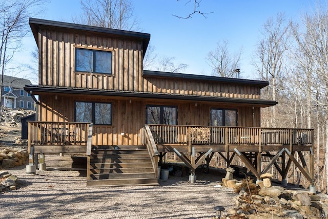 view of front of home with a deck and board and batten siding