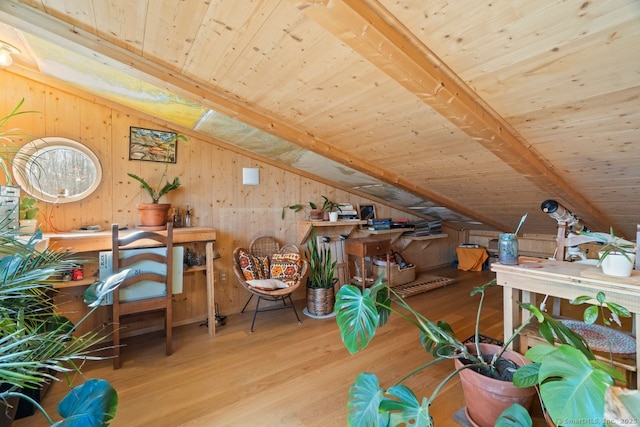 interior space with vaulted ceiling with beams, wooden ceiling, wood finished floors, and wood walls