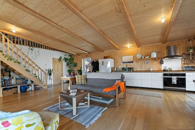 living room with light wood-type flooring, wooden ceiling, and beam ceiling