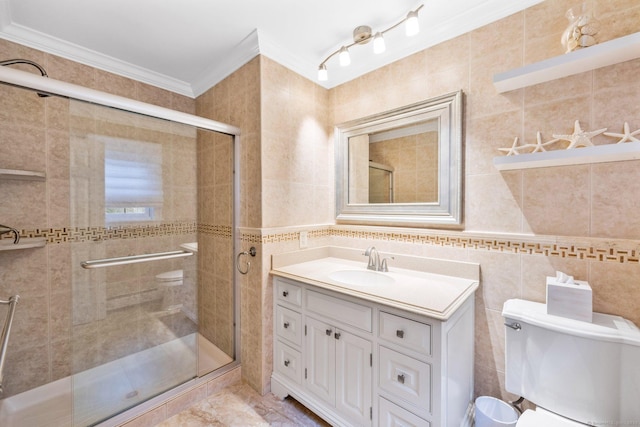 full bathroom with a stall shower, ornamental molding, tile walls, and vanity