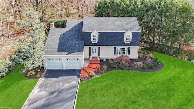 view of front of house featuring a garage, a front lawn, aphalt driveway, and roof with shingles