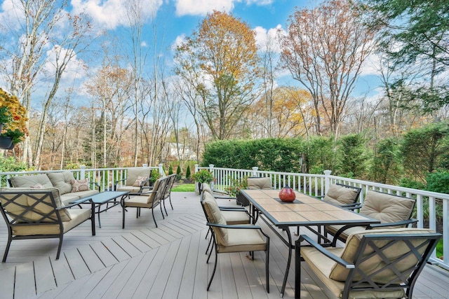 wooden deck featuring an outdoor living space and outdoor dining space