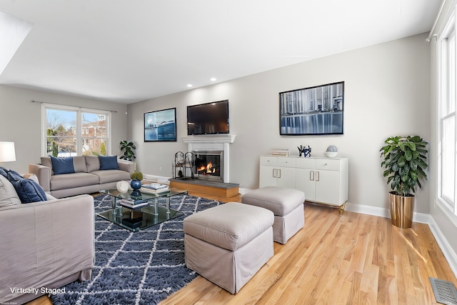 living room with light hardwood / wood-style floors