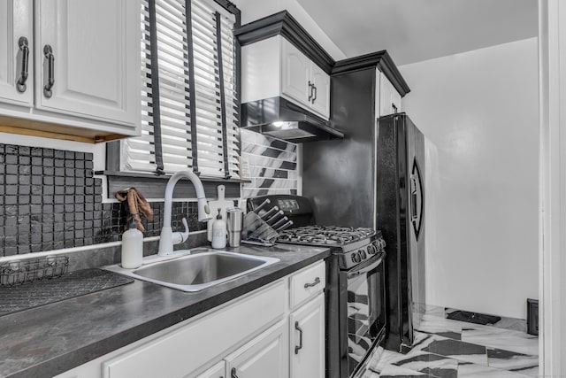 kitchen with white cabinetry, sink, black appliances, and decorative backsplash