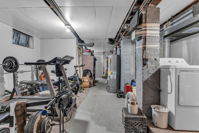 basement featuring washer / clothes dryer and water heater