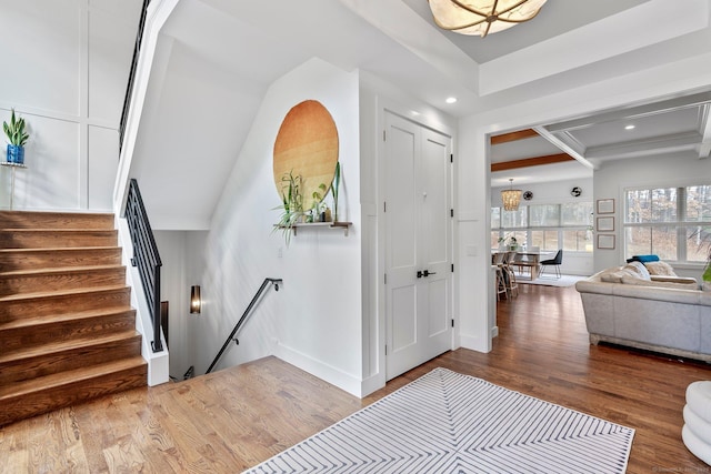 entrance foyer with stairway, recessed lighting, baseboards, and wood finished floors