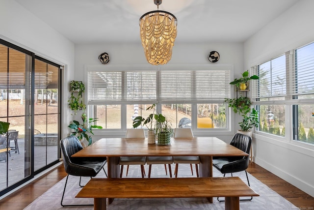 sunroom with a chandelier