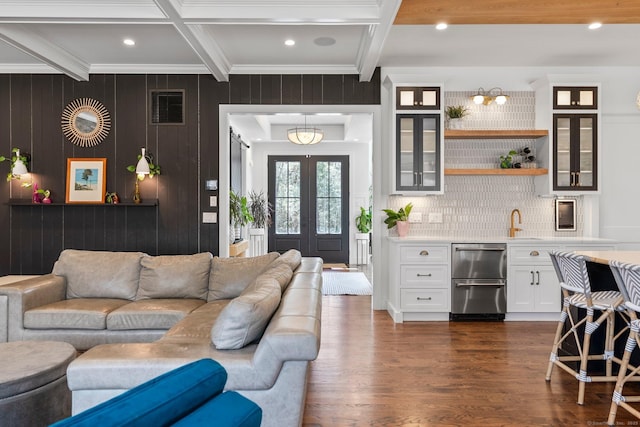 living area with visible vents, ornamental molding, beam ceiling, french doors, and dark wood-style flooring