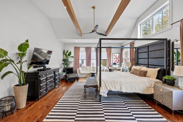 bedroom with multiple windows, beam ceiling, and wood finished floors