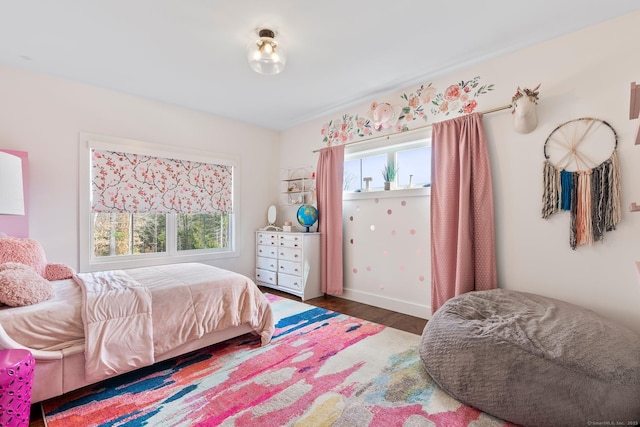 bedroom with wood finished floors