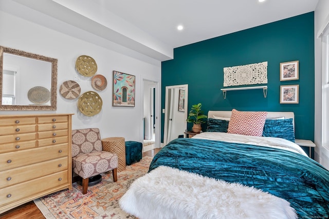 bedroom with recessed lighting and wood finished floors