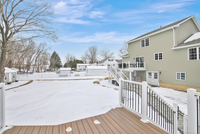 snow covered deck with stairway