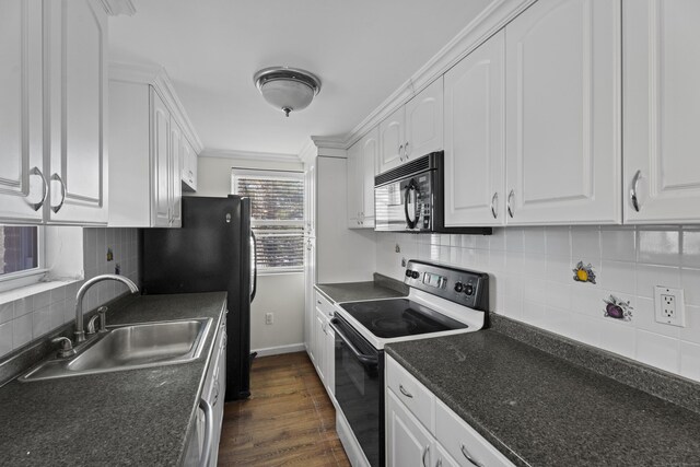 kitchen with tasteful backsplash, dark wood finished floors, black appliances, white cabinetry, and a sink