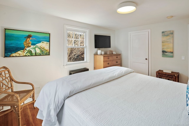 bedroom featuring wood finished floors