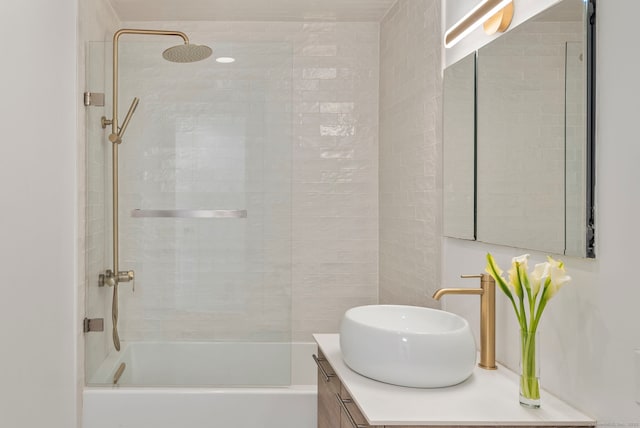 bathroom featuring shower / washtub combination and vanity