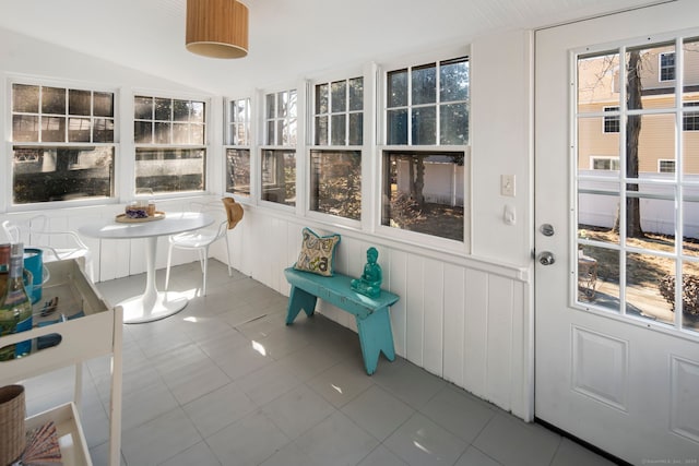 sunroom featuring lofted ceiling