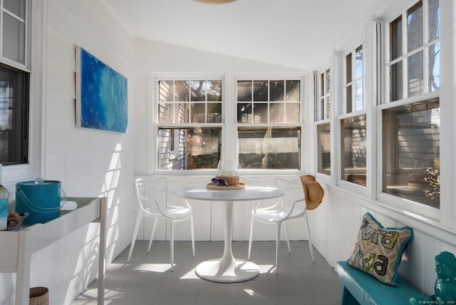 sunroom featuring vaulted ceiling