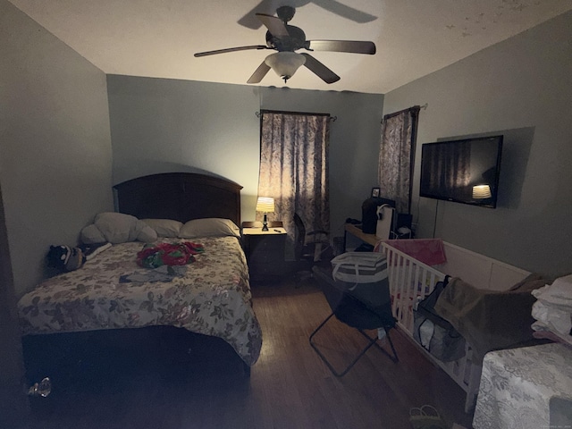 bedroom with wood finished floors and a ceiling fan