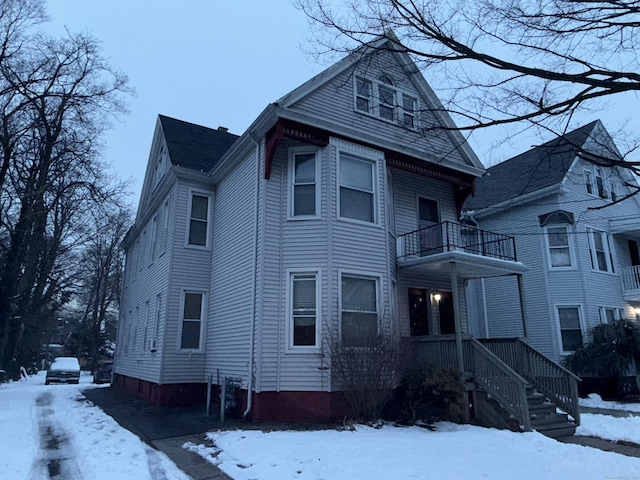 view of front of home with a balcony