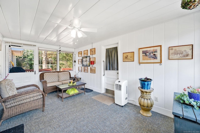 sunroom with a ceiling fan