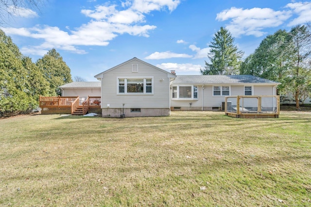 rear view of house with a lawn, cooling unit, and a deck